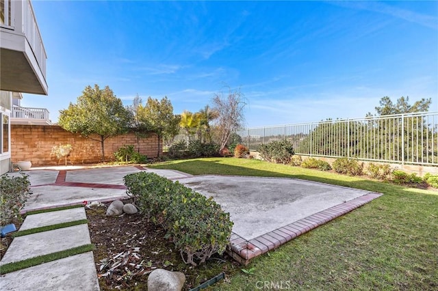 view of yard with a fenced backyard and a patio