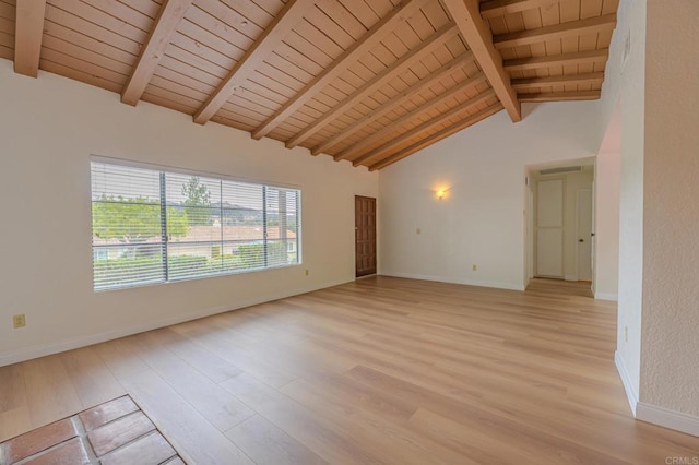 empty room featuring wood ceiling, beam ceiling, high vaulted ceiling, and light wood-type flooring