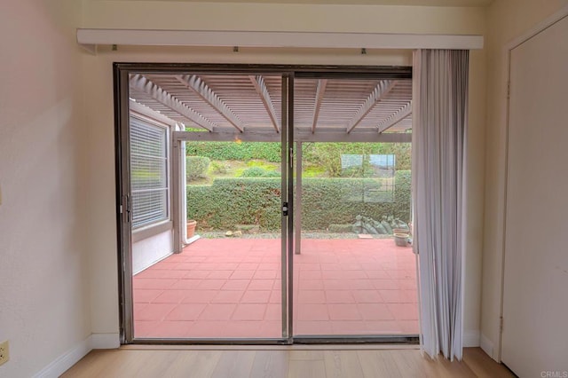 doorway to outside with light hardwood / wood-style flooring