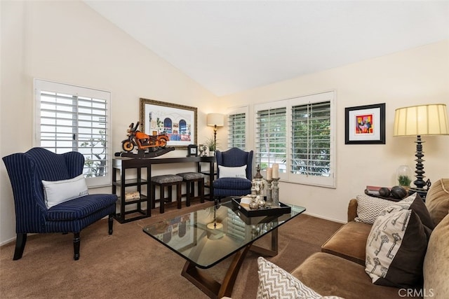 living area featuring carpet floors and high vaulted ceiling