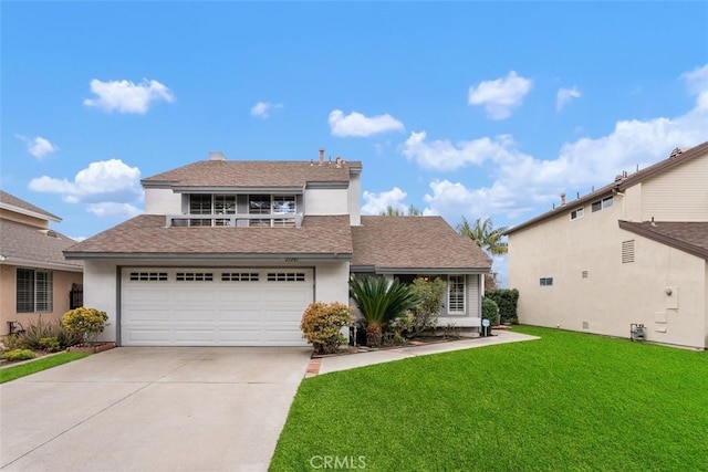 traditional-style house with a garage, concrete driveway, a front lawn, and stucco siding