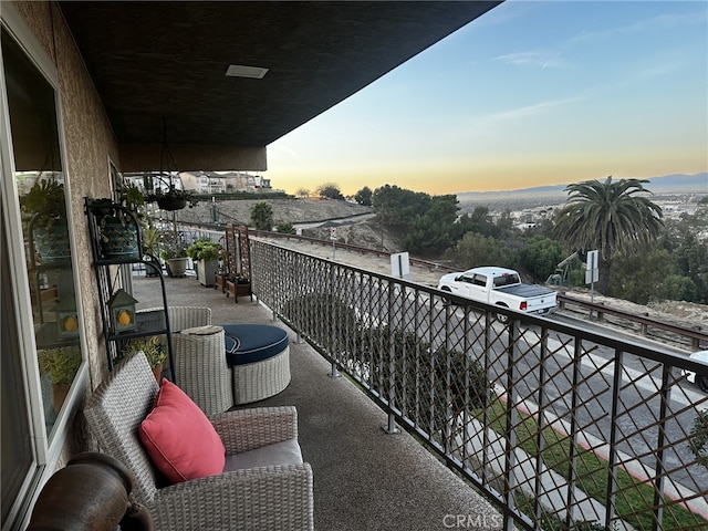 view of balcony at dusk