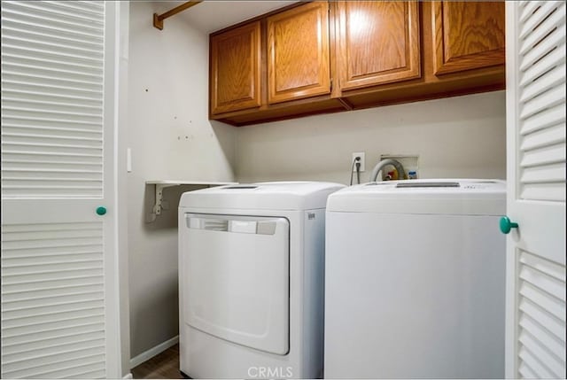 laundry area featuring cabinets and washer and dryer