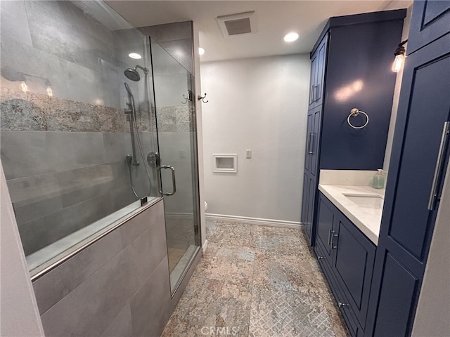 bathroom featuring walk in shower, vanity, and toilet