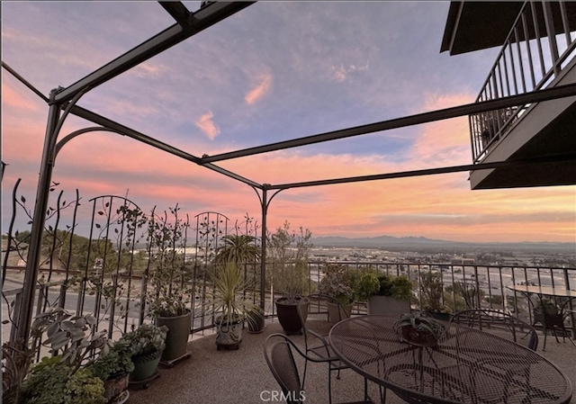 view of patio terrace at dusk