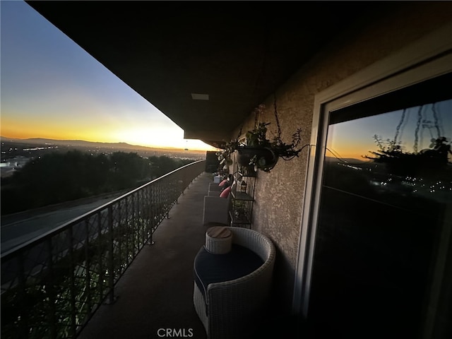 view of balcony at dusk