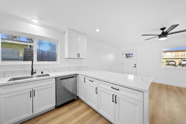 kitchen with sink, light hardwood / wood-style flooring, dishwasher, white cabinetry, and kitchen peninsula