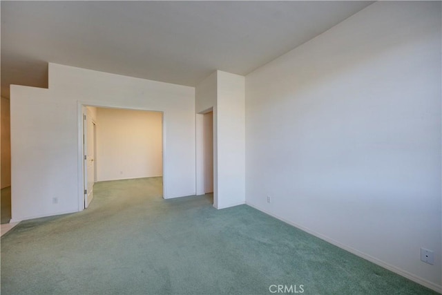 empty room with light colored carpet