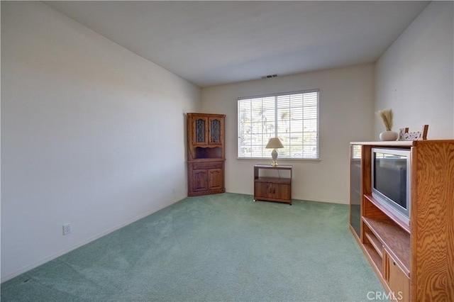 spare room with light colored carpet