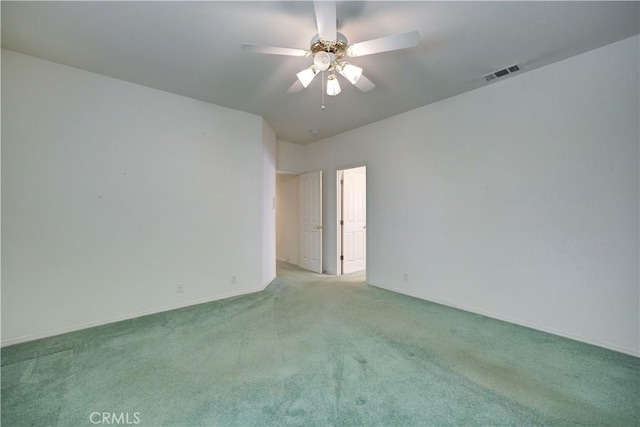 carpeted empty room featuring ceiling fan