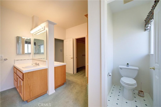 bathroom with vanity and toilet