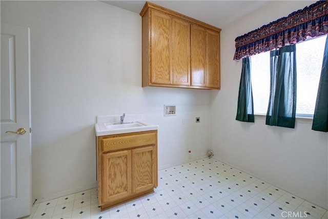 washroom with cabinets, sink, electric dryer hookup, and hookup for a washing machine