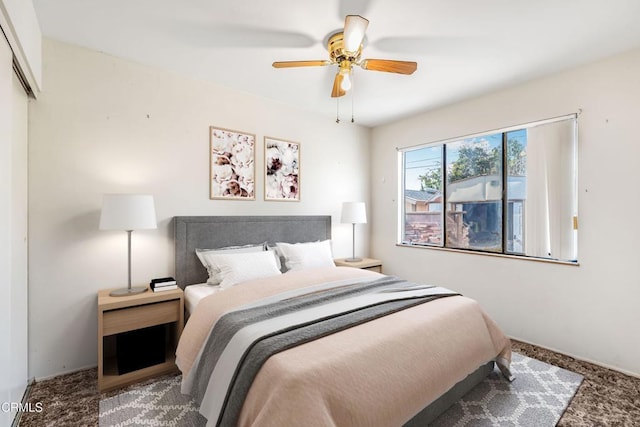 carpeted bedroom featuring ceiling fan