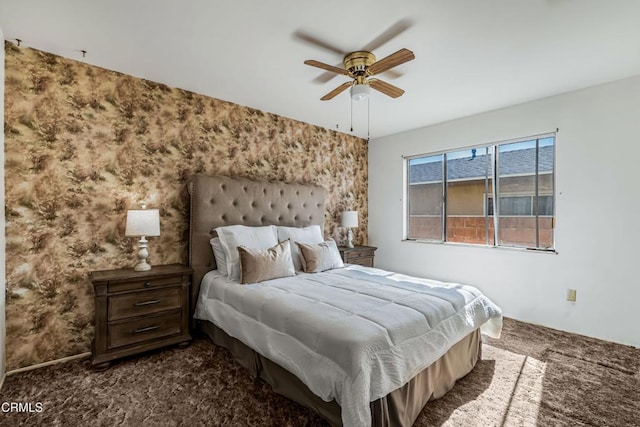 bedroom featuring ceiling fan and dark colored carpet