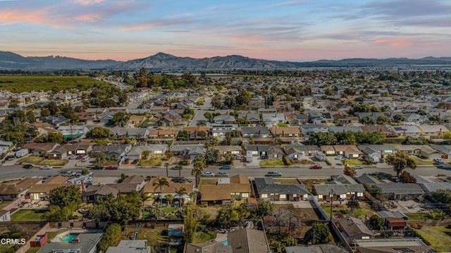 aerial view at dusk with a mountain view