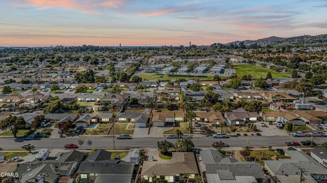 aerial view at dusk with a mountain view