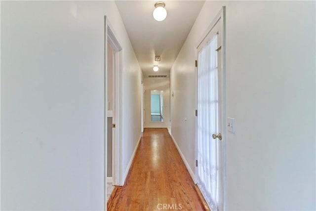 hallway featuring light wood-type flooring