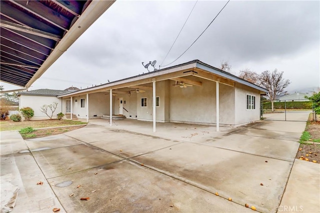 view of front of property featuring a patio area and ceiling fan