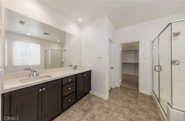 bathroom with vanity and an enclosed shower