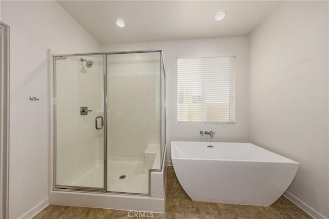 bathroom featuring plus walk in shower