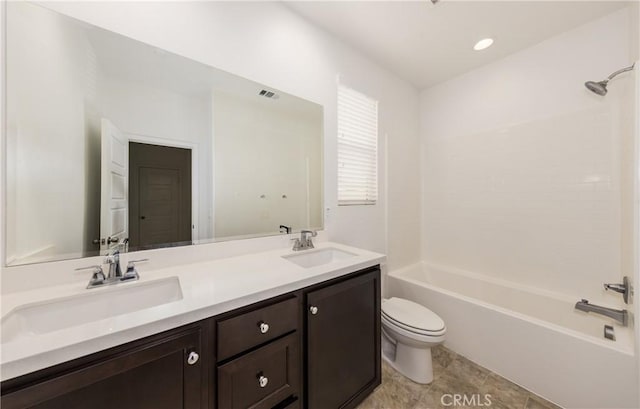 full bathroom with vanity, shower / bathtub combination, and toilet