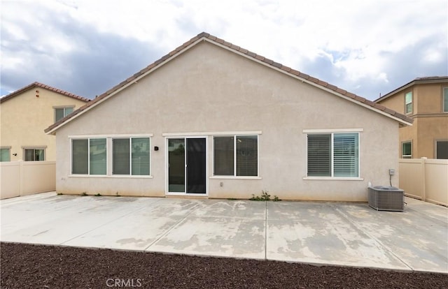 back of property with a patio and central air condition unit