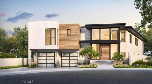 23502 Seaward Isle, Dana Point, CA 92629 - modern home featuring a garage, driveway, and stucco siding
