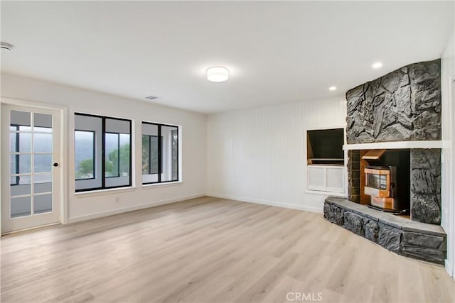 unfurnished living room featuring light wood-type flooring