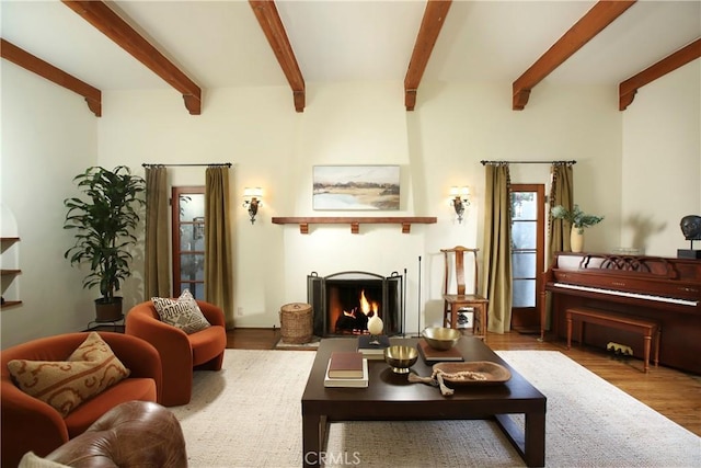 living room with beamed ceiling and hardwood / wood-style floors