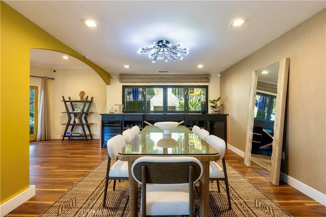 dining area with wine cooler and dark hardwood / wood-style flooring