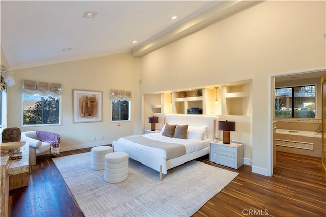 bedroom featuring dark hardwood / wood-style flooring and high vaulted ceiling