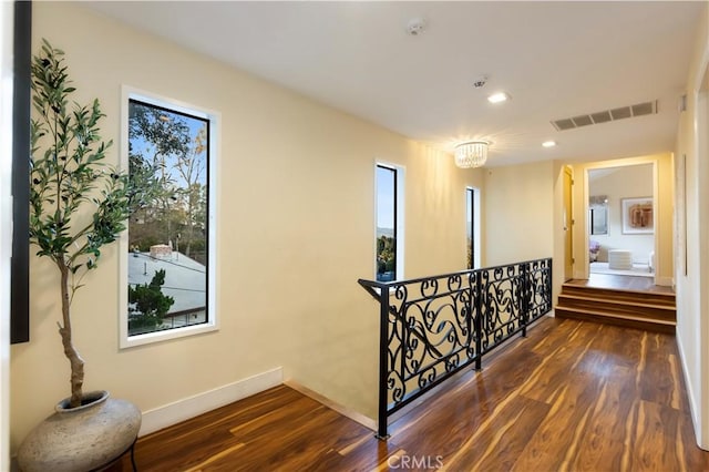 corridor featuring dark hardwood / wood-style floors