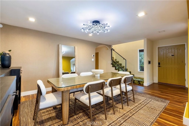 dining area with dark hardwood / wood-style flooring