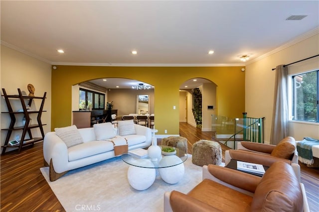 living room with hardwood / wood-style flooring and ornamental molding