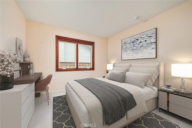 bedroom featuring light colored carpet