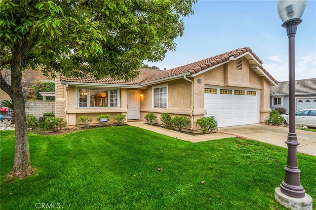 view of front of home featuring a garage and a front lawn