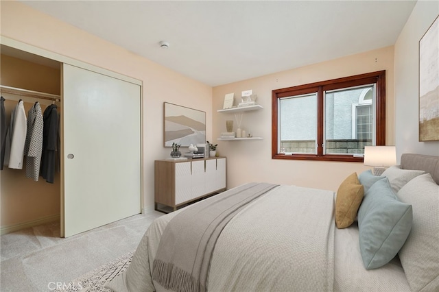 carpeted bedroom with a closet