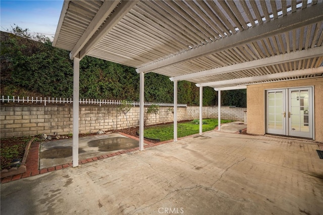 view of patio with french doors and a pergola