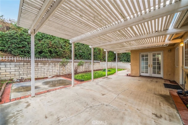 view of patio / terrace featuring french doors and a pergola