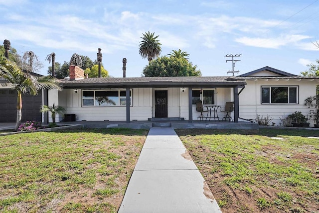 ranch-style home featuring a front yard