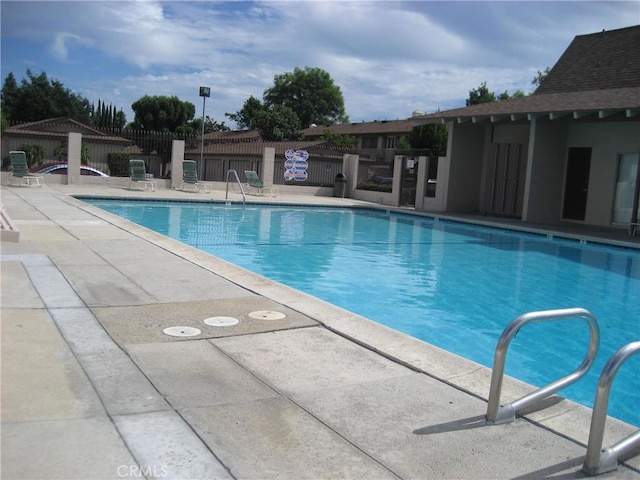 view of swimming pool featuring a patio area