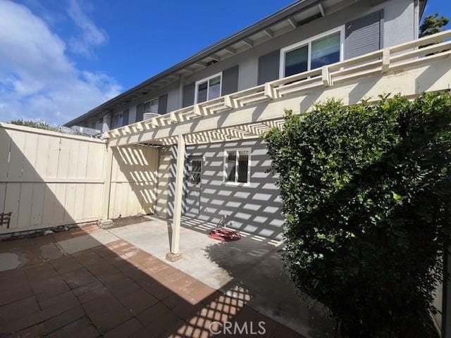 back of house featuring a pergola and a patio area