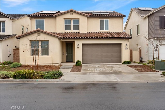 view of front of home featuring central AC unit, driveway, stucco siding, a garage, and a tiled roof