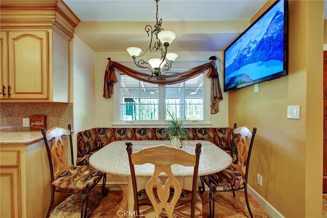 dining room featuring an inviting chandelier and breakfast area