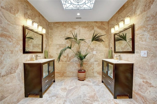 bathroom featuring tile walls and vanity