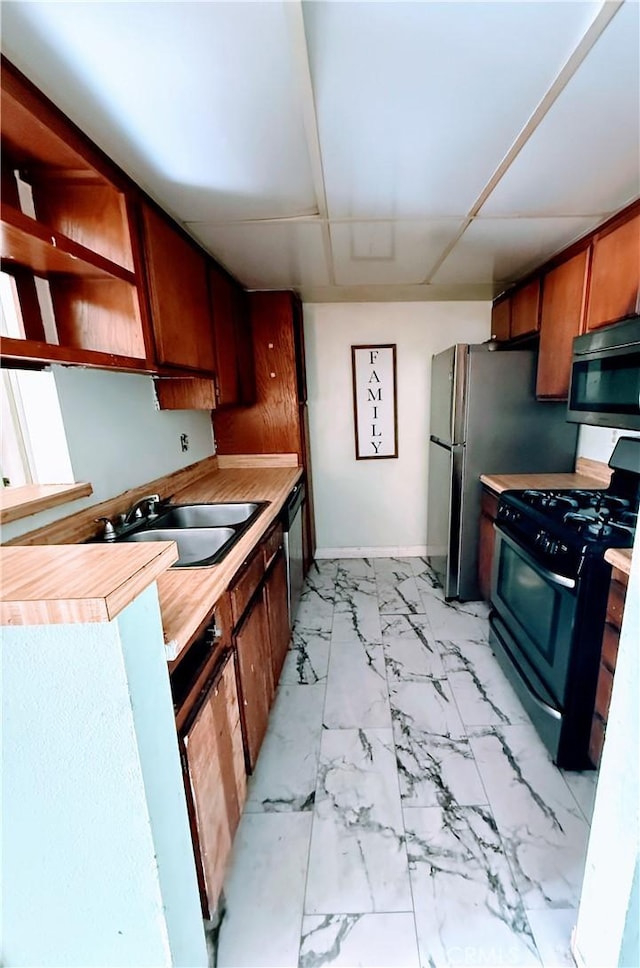 kitchen featuring stainless steel appliances and sink