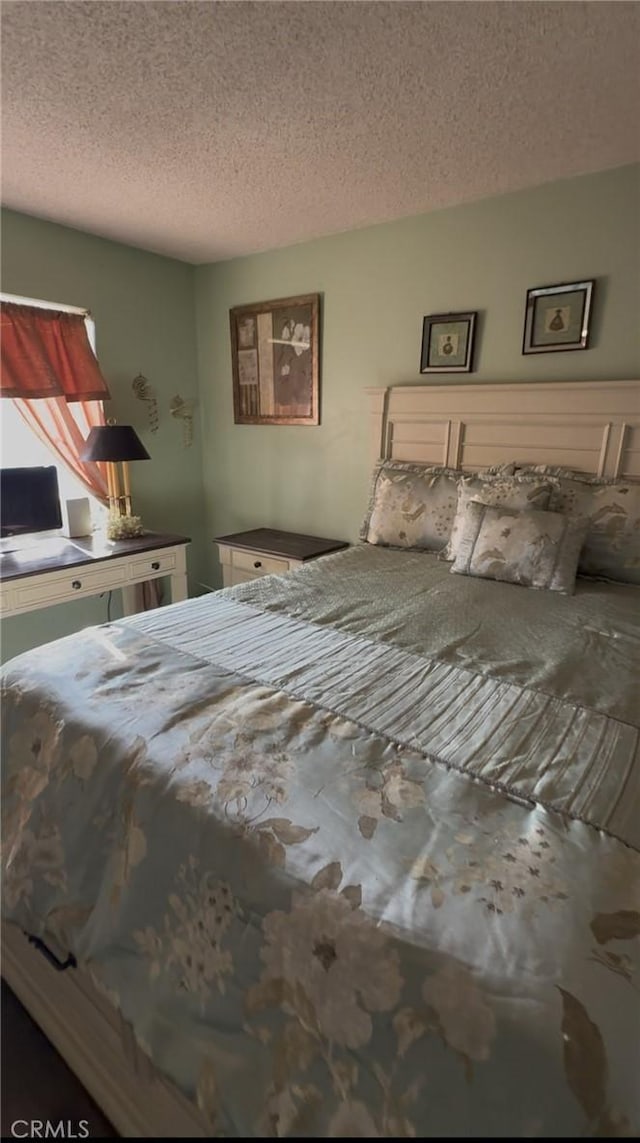 unfurnished bedroom featuring a textured ceiling