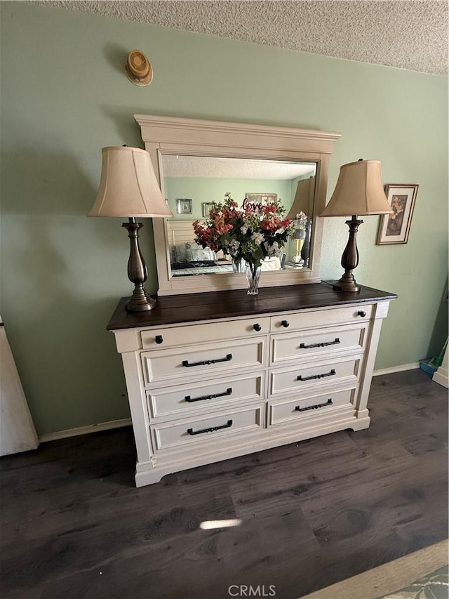 room details with hardwood / wood-style floors and a textured ceiling