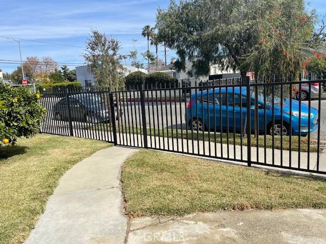 view of gate featuring a yard