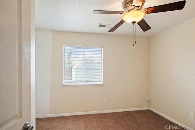 carpeted empty room featuring ceiling fan